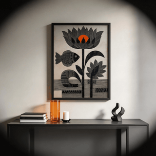 Lotus Fish wall art with black fish and flowers with an orange circle above a black shelf with decorative objects