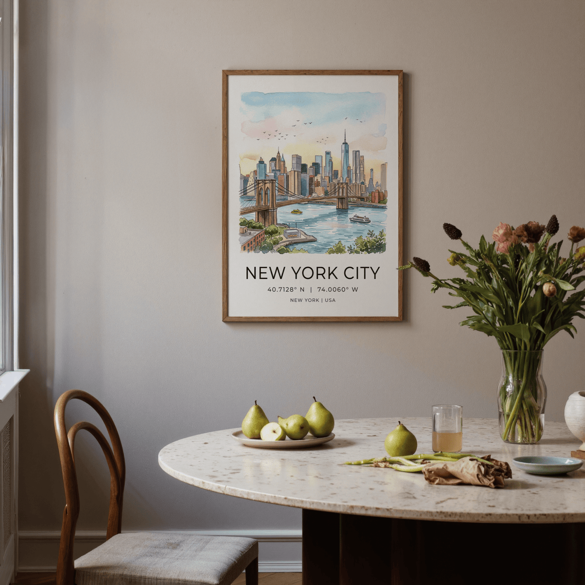 New York City wall art above a dining table with pears and flowers in a vase