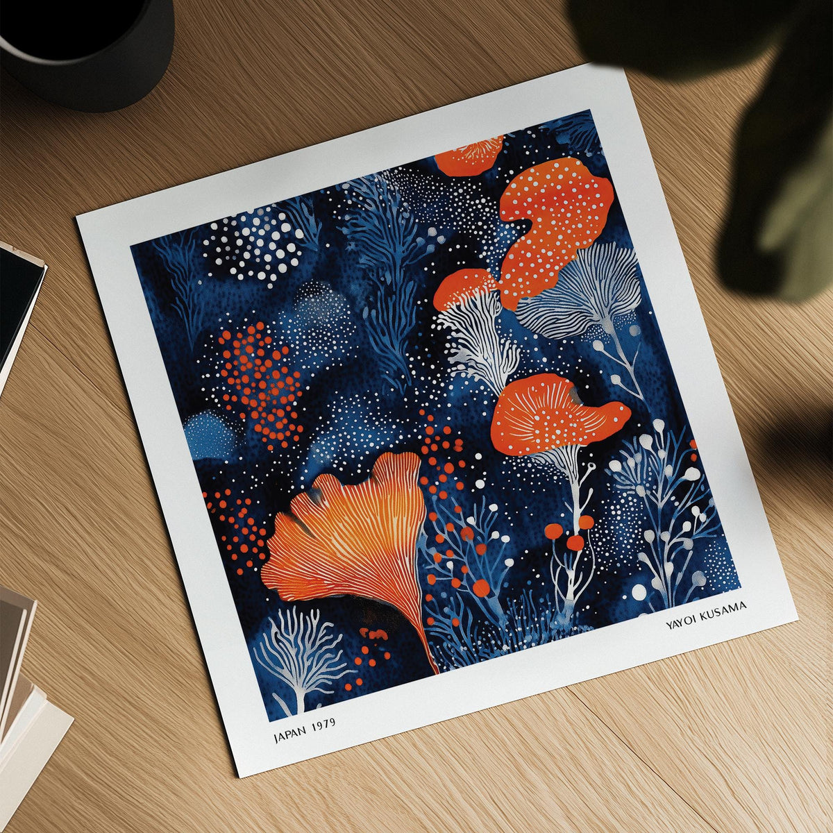 Unique Living Room Wall Art showing blue and orange abstract floral shapes on a wooden surface with a black cup nearby