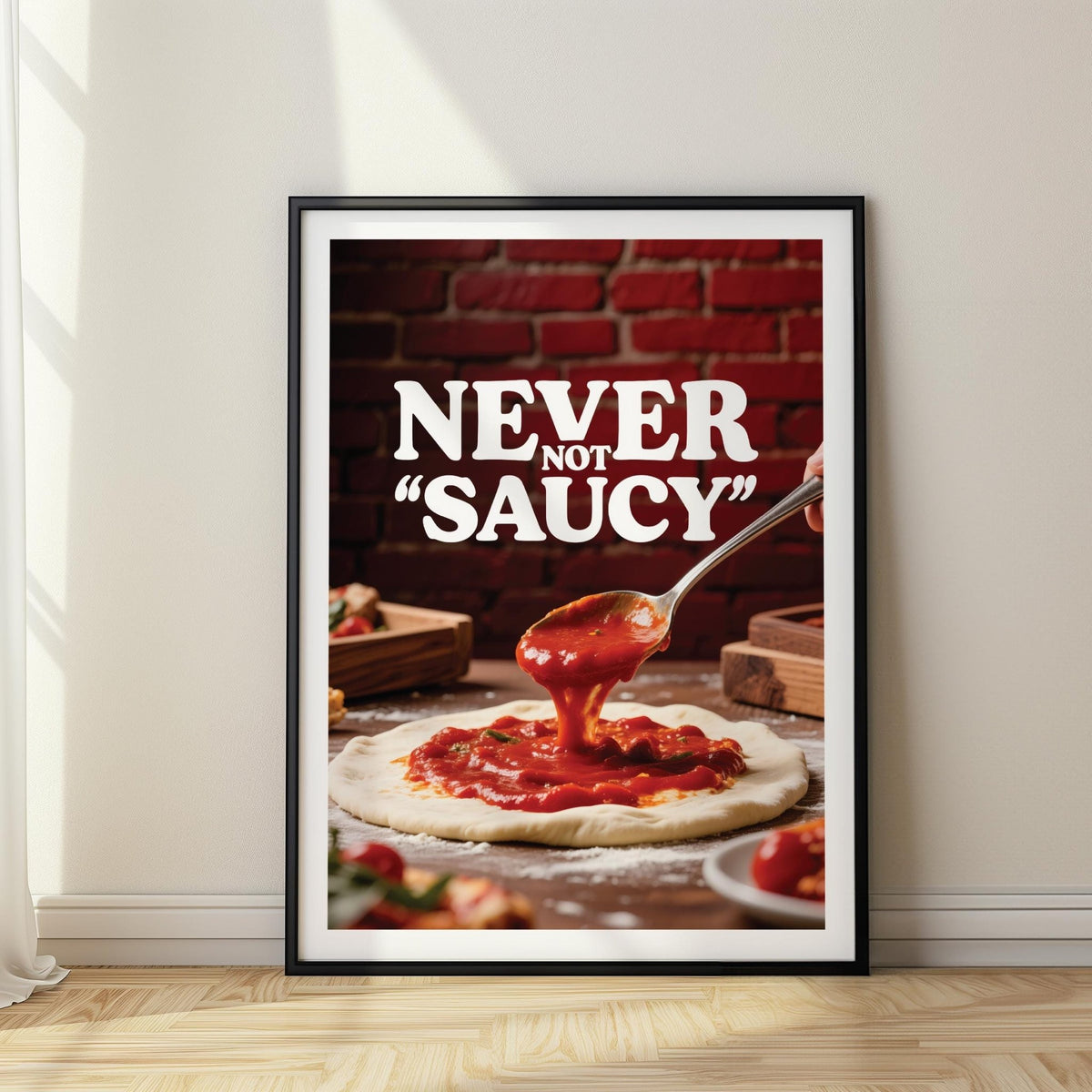 Framed Pizza Wall Art with pizza sauce on dough against a red brick background leaning on wooden floor near window