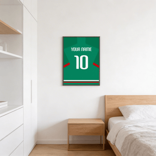 Football Shirt Poster in Green with Red Sleeve Stripe hanging above a wooden bedside table in a bedroom