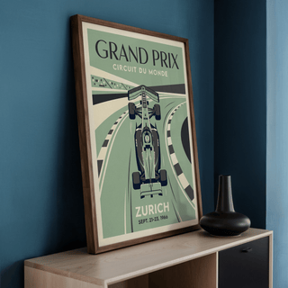 Circuit Of Zurich Print leaning on a cabinet with a black vase against a blue wall
