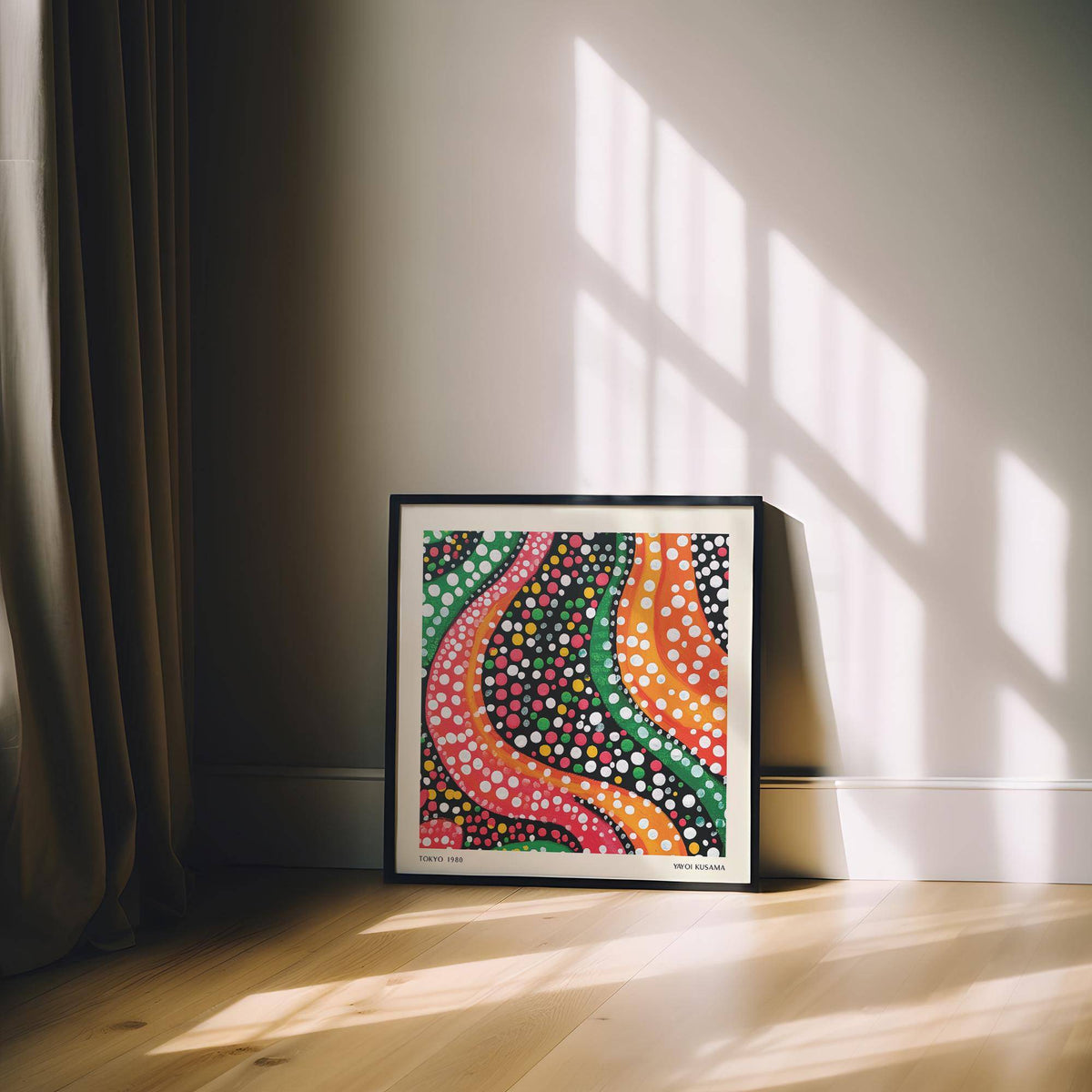 Abstract colorful art framed print with wavy lines and dots leaning against a cream wall beside beige curtains