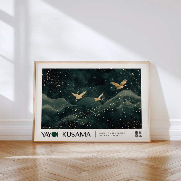 Japanese wall hanging framed print of golden cranes flying above waves leaning on a wooden floor with sunlight