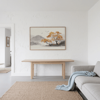 Autumn Tree Art Print hung above a wooden table in a minimalist living room with a grey sofa