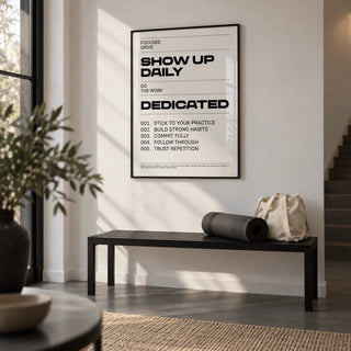 Daily Affirmations Print, framed on the wall of a monochrome hallway with a white wall and a dark grey floor