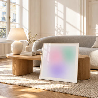 Danish Pastel Print, framed and leaning against a coffee table in a bright living room