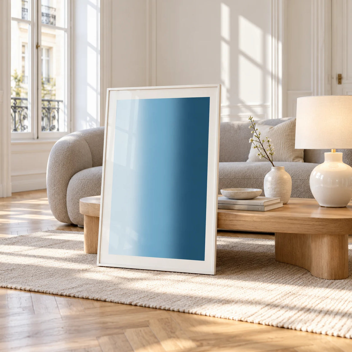 Dark Blue Wall Art, framed and leaning against a coffee table in a bright living room