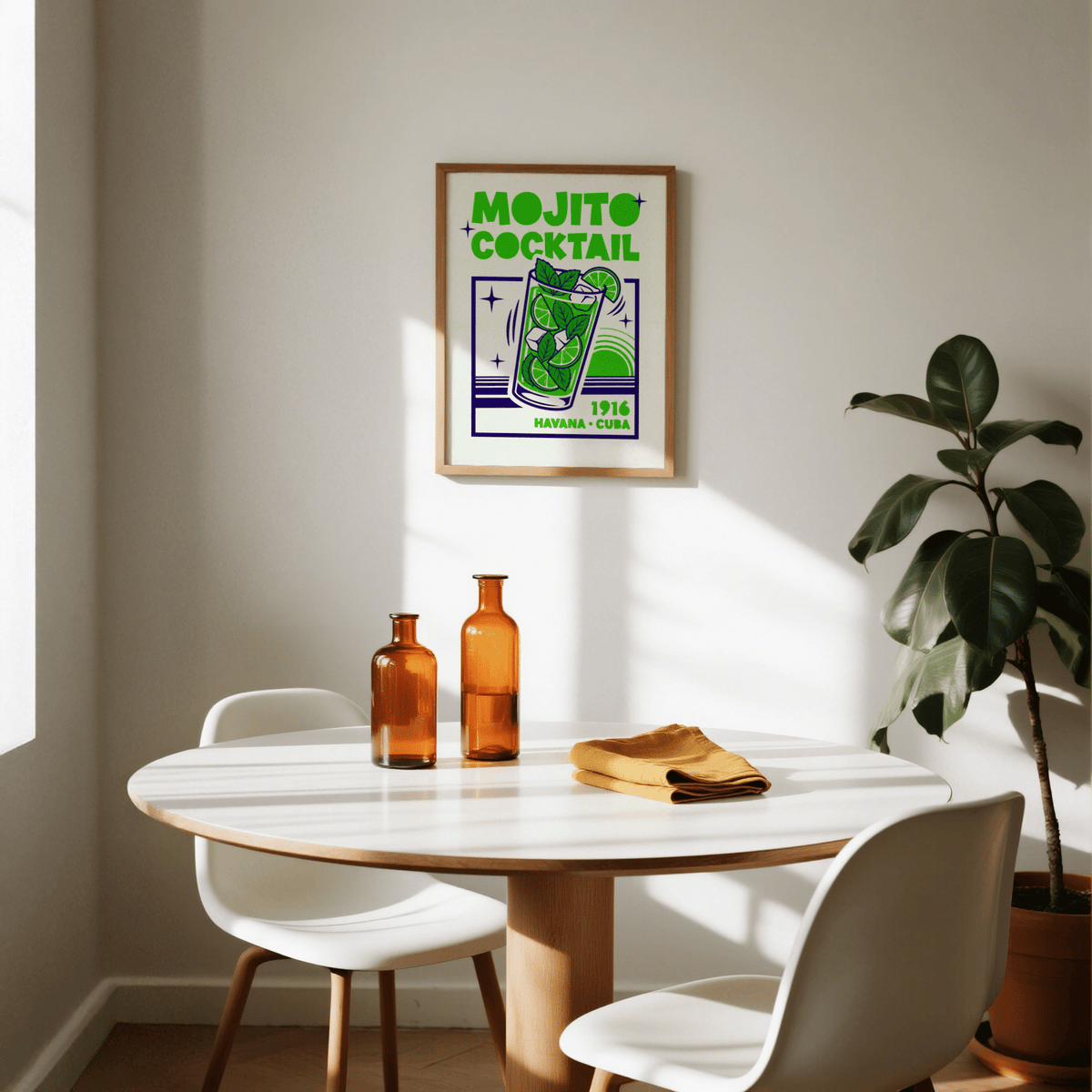 Mojito Cocktail Print hanging above a dining table with amber bottles and a potted plant nearby