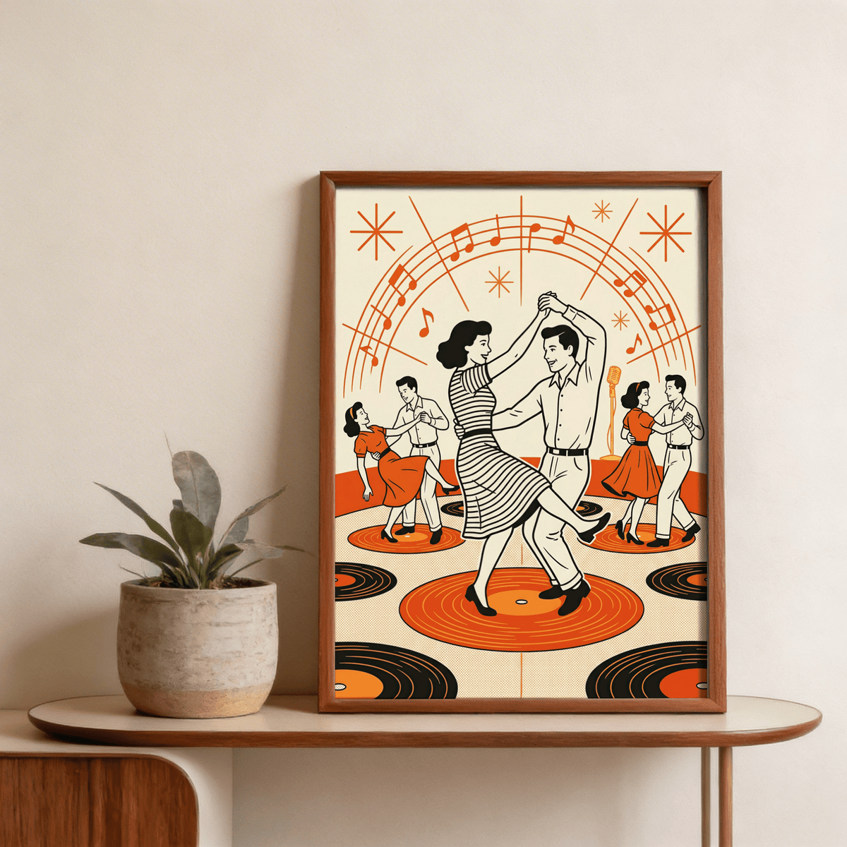 Framed print of swinging dancing couple with retro music notes and orange records on a wooden table with a plant