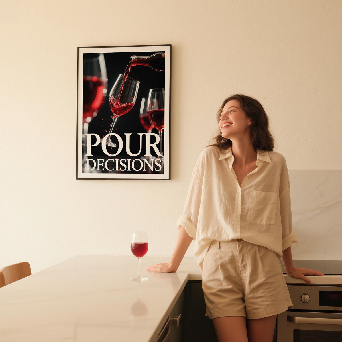 Gift for Wine Lovers wall art of red wine pouring into a glass in a kitchen with a woman nearby and a wine glass on the counter