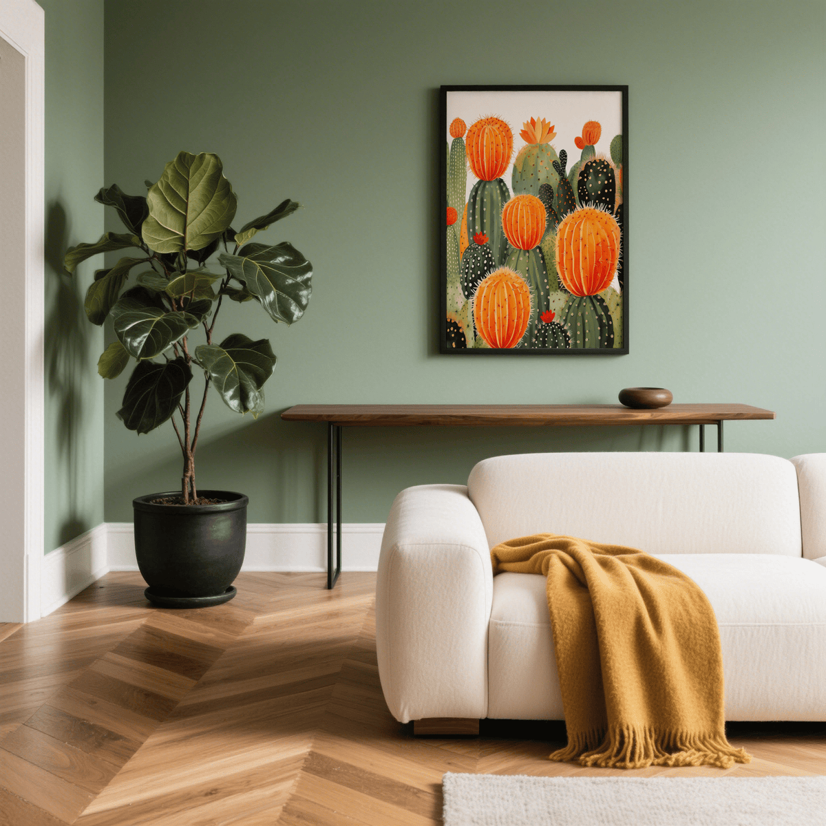 Large Cactus Wall Art with bright orange blooms in black frame on green wall in living room with plant
