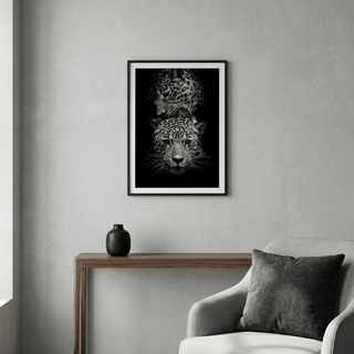 Leopard Photography Print of two leopards in close embrace in black and white above a wooden console table