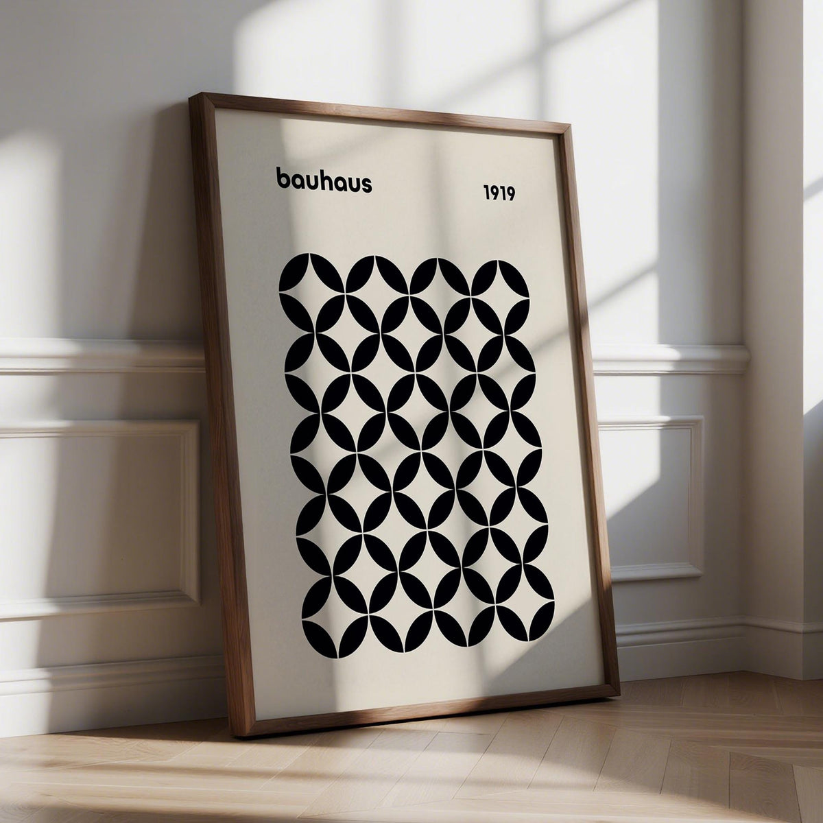 Mid Century Wall Print leaning on floor with black geometric grid in natural light