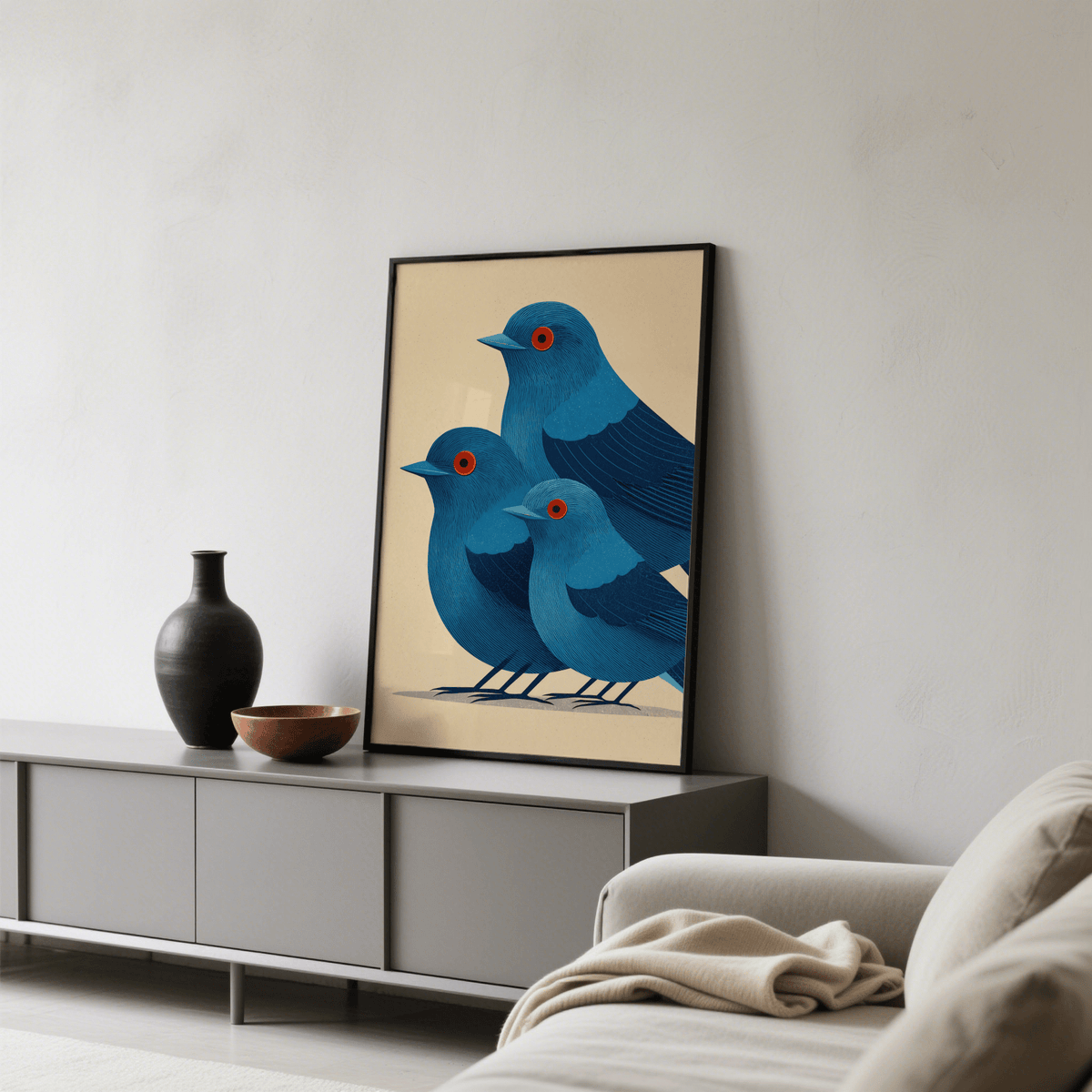 Blue Bird Art Print leaning on a grey sideboard with vessels in a grey living room