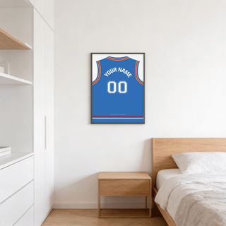 Framed basketball jersey poster in blue with red and yellow trim above a wooden bedside cabinet