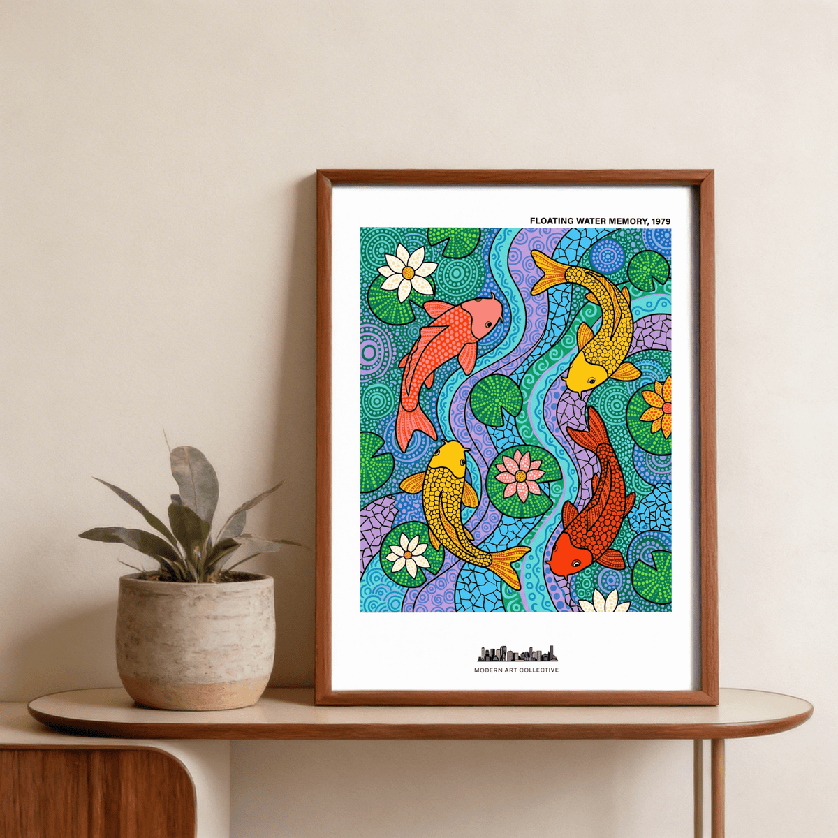 Koi Fish wall art with colourful fish and green lily pads in a wooden frame leaning on a table beside a plant
