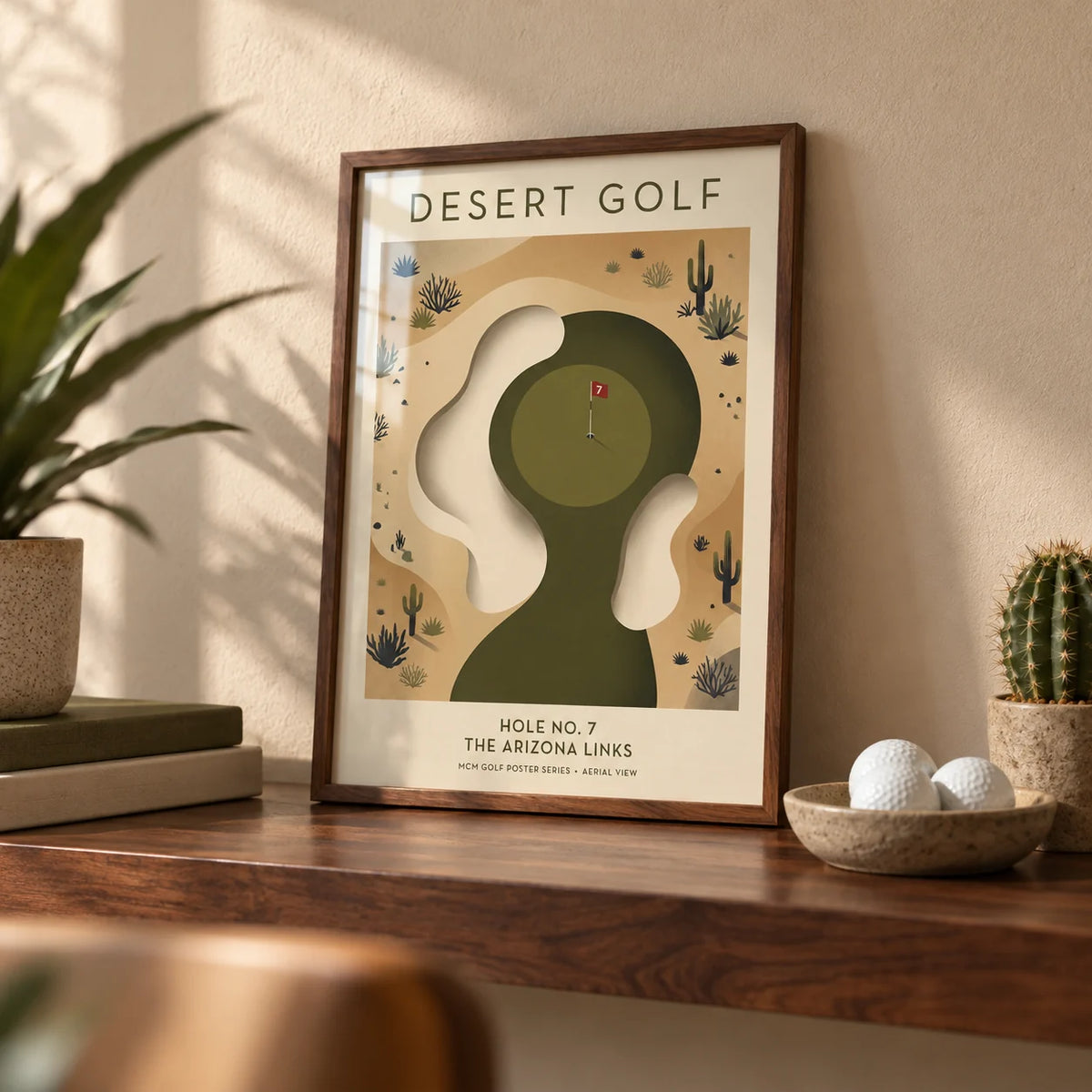 Desert Golf Print, a small A4 framed print leaning on a walnut shelf in a living room