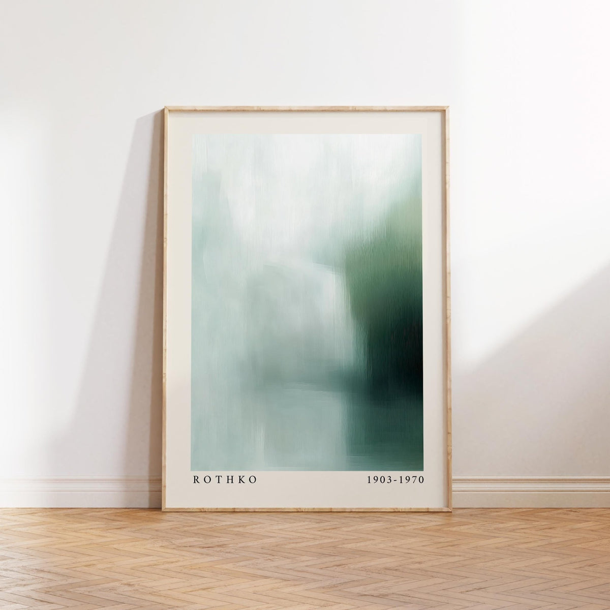 Print leaning on a wooden floor wall art abstract in blue and green soft tones
