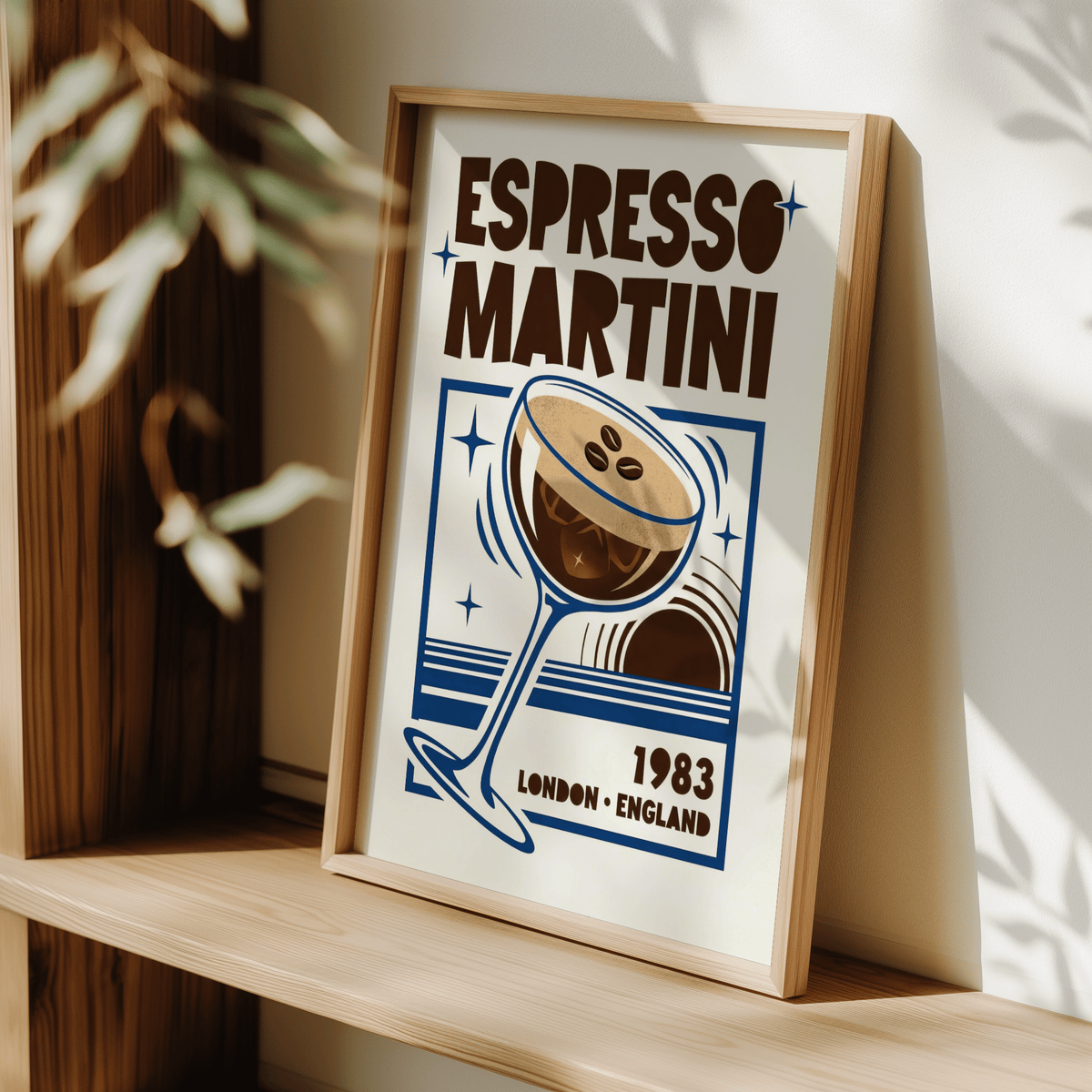 Print leaning on a shelf Espresso Martini Print with retro typographic style and blue, brown colours