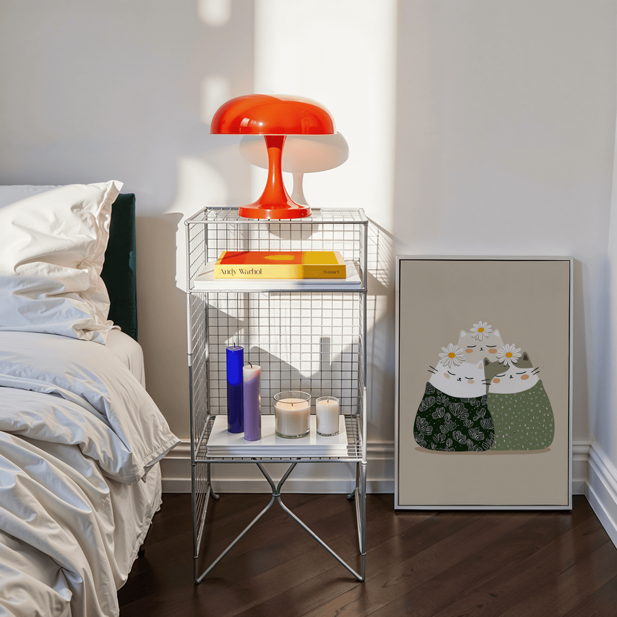 Illustrated Cat Wall Art print leaning beside a metal shelf with books and candles in a bedroom