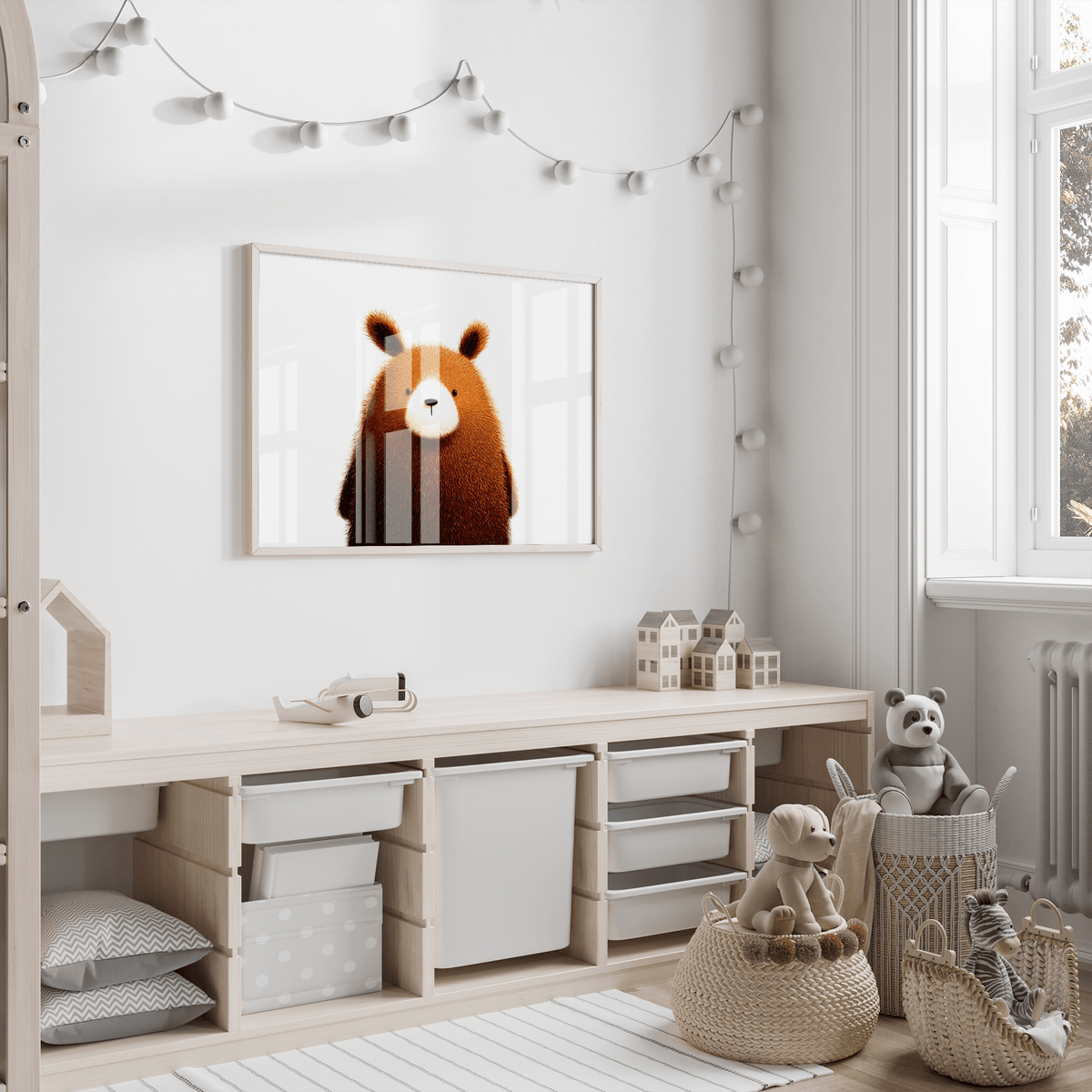 Print on a wall of a brown cartoon bear with a white face in a child's playroom next to toys
