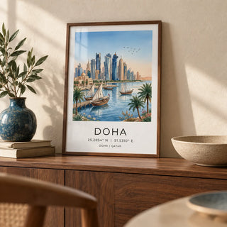 Doha City Art Print, a small A4 framed print leaning on a walnut sideboard in a living room