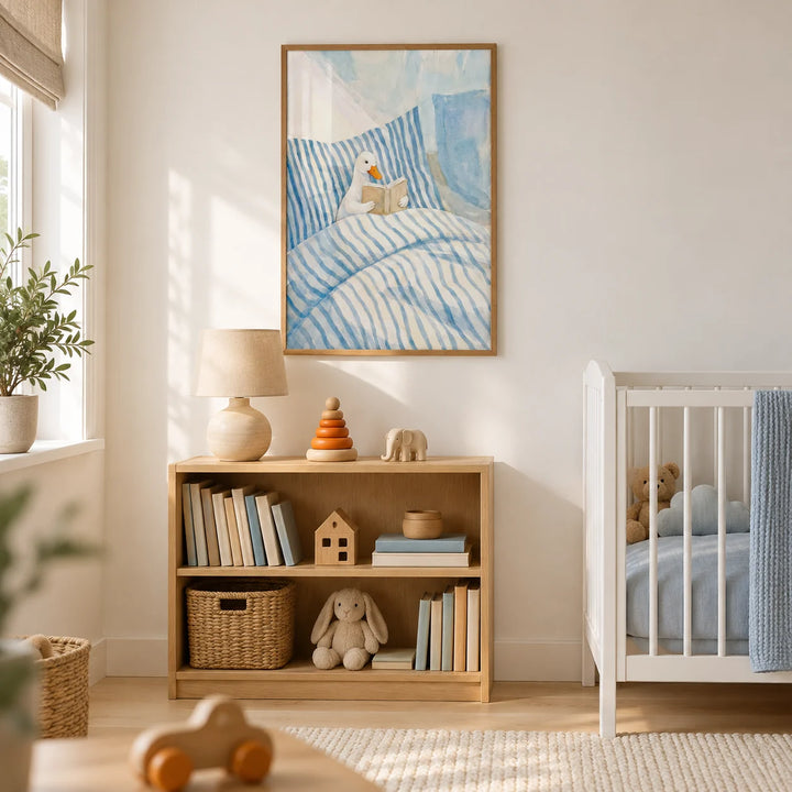 Duck Reading Art Print, framed on the wall of a calm nursery in a UK family home with warm white walls and pale oak floorboards
