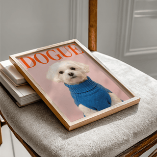 Framed Maltese Dog Wall Art of a white dog in a blue jumper on a chair with books