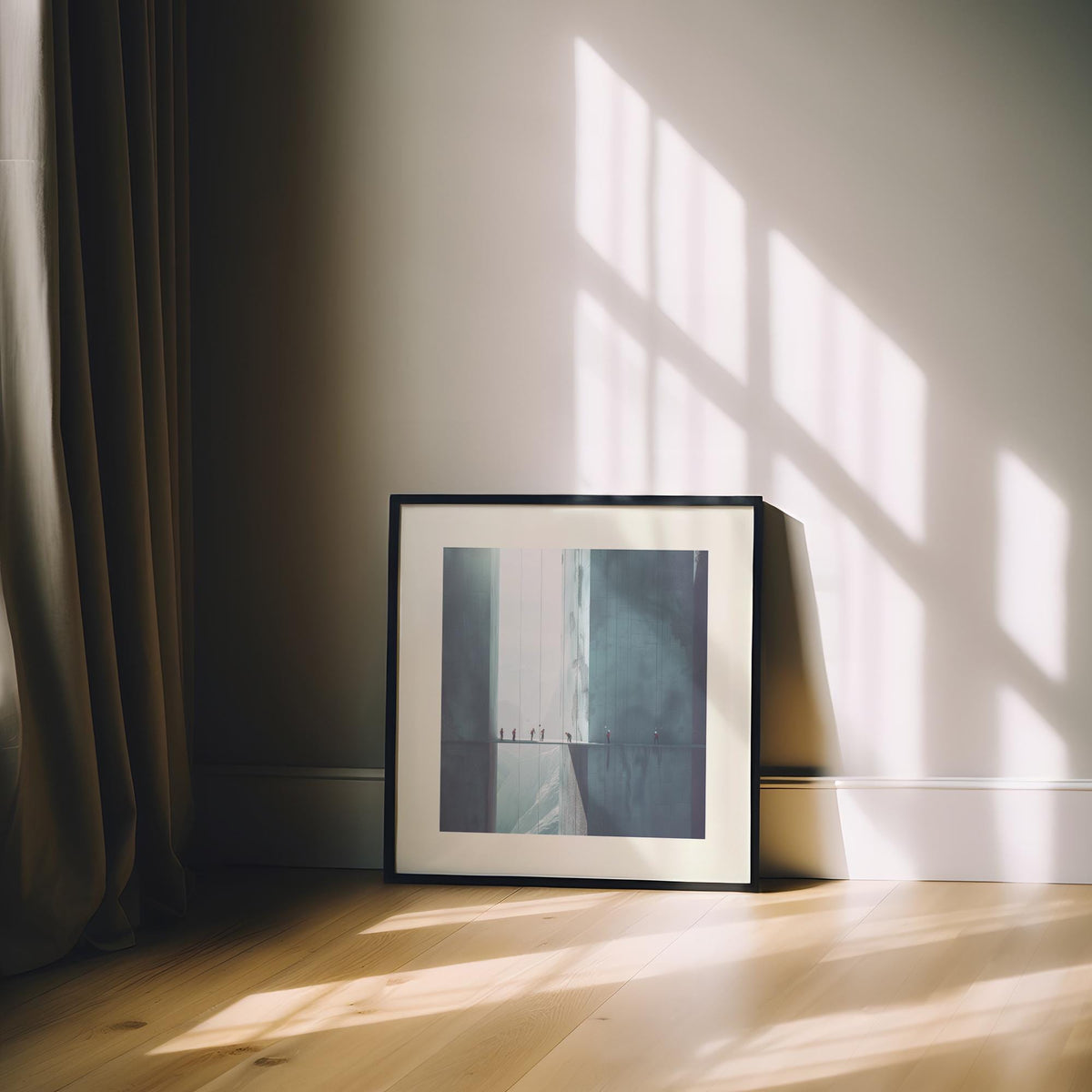 Framed surreal art print of rope climbers in muted blue tones leaning against a wall with curtain nearby