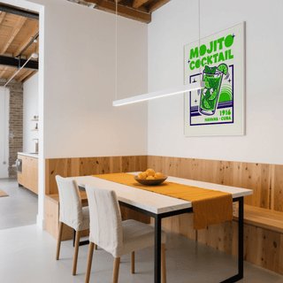 Mojito Cocktail Print on a white wall above a dining table with wooden panel and orange runner