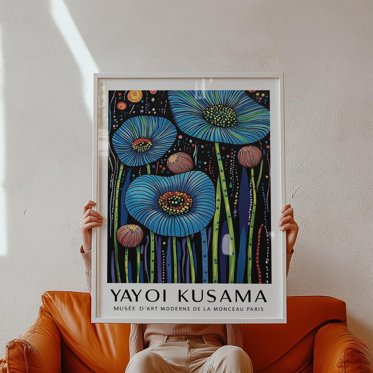 Framed print blue poppy flowers in blue and pink with black background held in hands