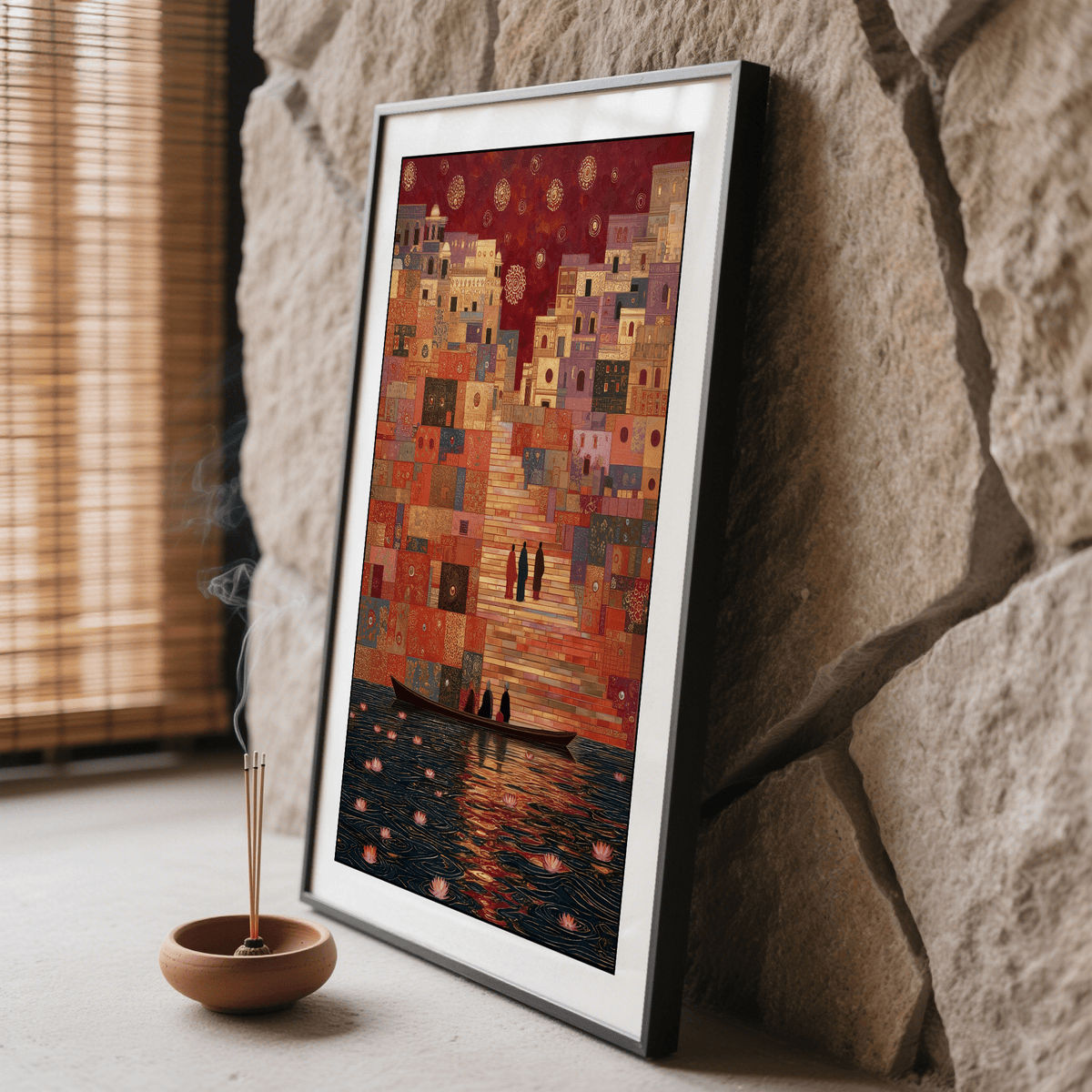 Framed close-up of Varanasi art print showing people on boat by stairs in warm reds and oranges with incense burning nearby