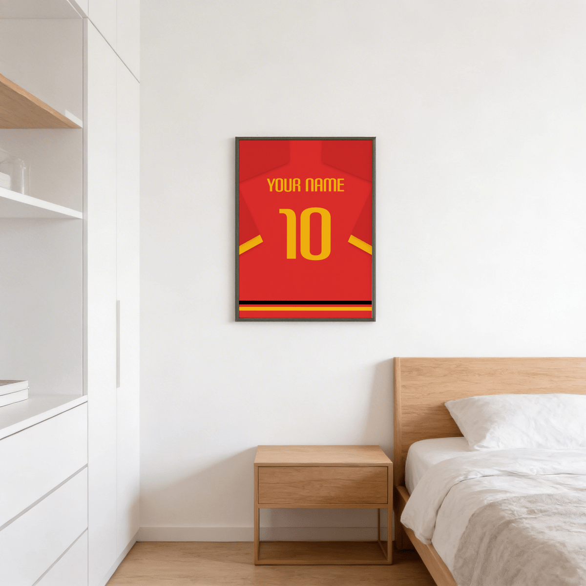 Football Shirt Poster in Red with Yellow Number and Sleeve Stripe above a wooden bedside table in a bedroom