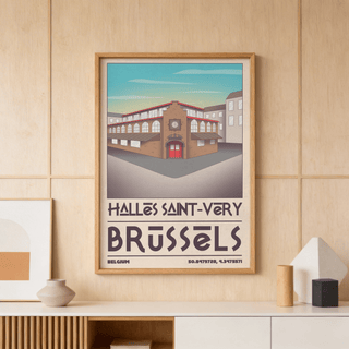 Framed Brussels Architecture Art Print of Halles Saint-Véry building with blue sky on a wooden paneled wall above decorative objects