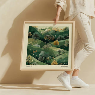Large Nature Wall Art held by person showing green hills with trees illustration in wood frame