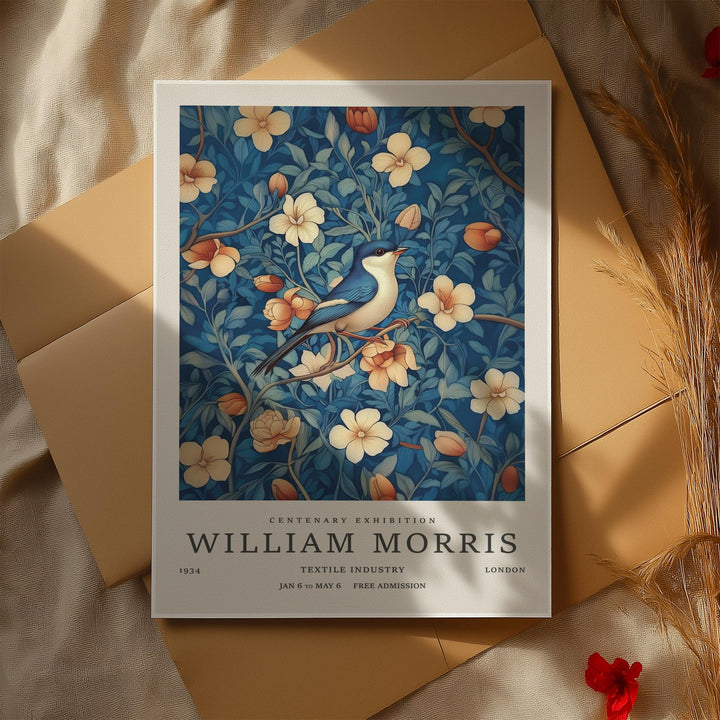 William Morris art showcasing a bluebird among apricot and cream blossoms with deep blue foliage.