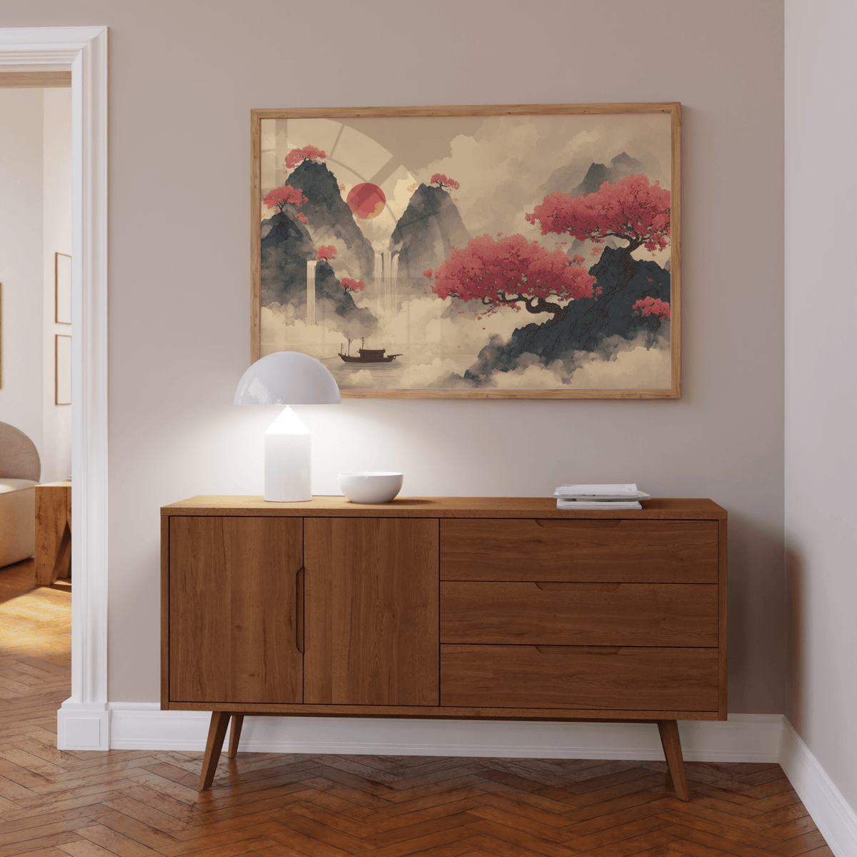 Chinese Ink wall art of red cherry blossom trees and mountains above a wooden sideboard with a table lamp