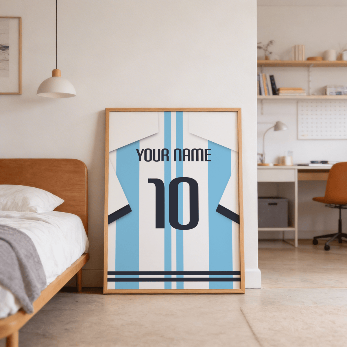 Print leaning on floor of a football shirt poster in light blue and white stripes beside a wooden bed