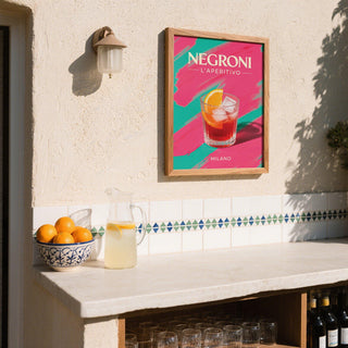 Retro Cocktail Art print of a negroni drink with orange slice on an outdoor wall above a jug and bowl of oranges
