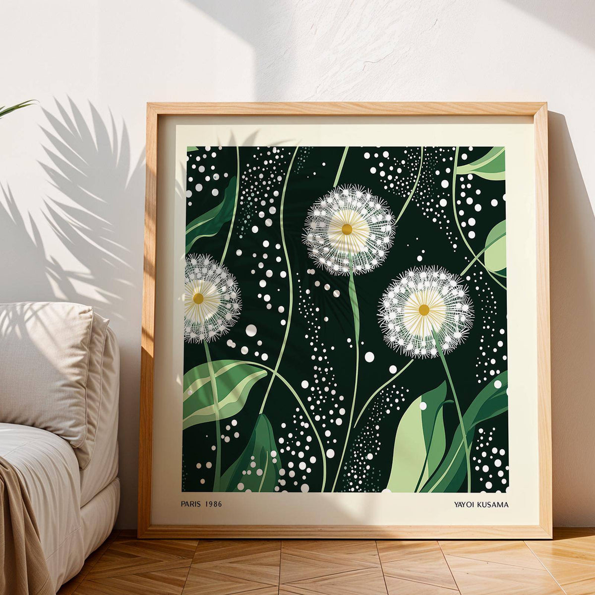 Framed close-up of green wall decor showing dandelion seed heads on dark green background with light green leaves