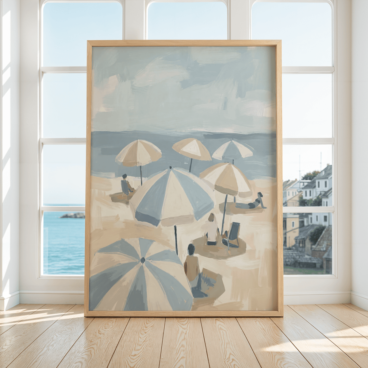 Framed Beach Umbrella Art with blue and beige umbrellas on a sandy beach in front of large windows