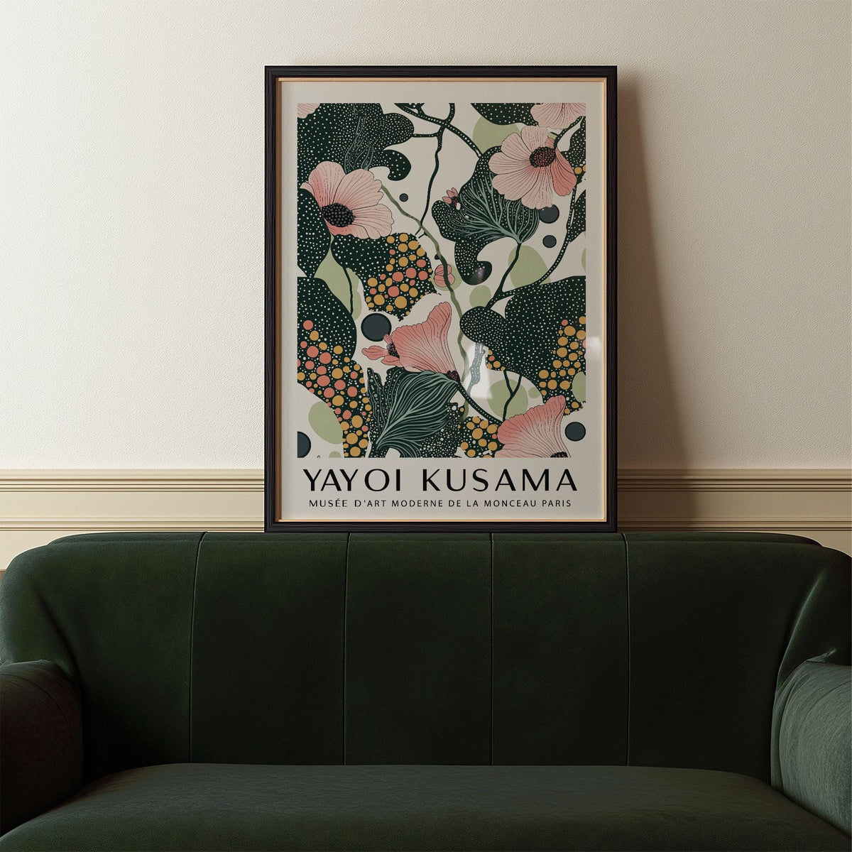 Wall Art with Pink Flowers framed print with pink flowers and dark green leaves above a green velvet sofa