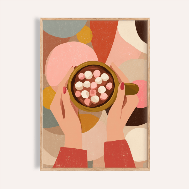 Framed Hot Chocolate wall art showing hands holding a cup with marshmallows against abstract coloured shapes
