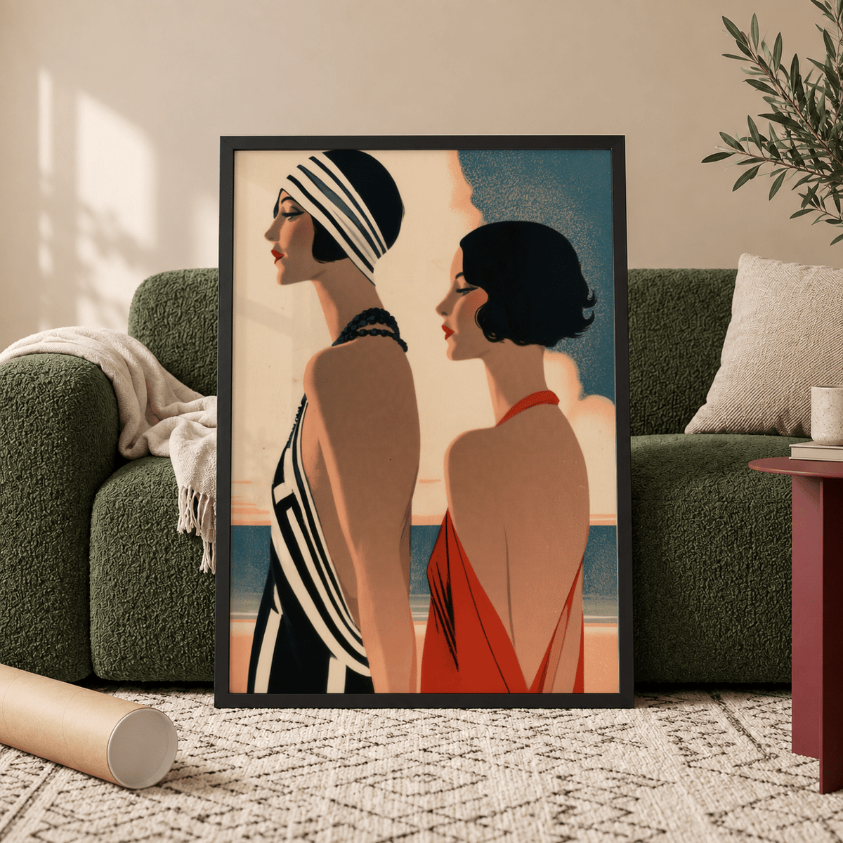 Framed Art Deco Riviera Fashion Print showing two elegant women in earthy and blue tones leaning against a green sofa
