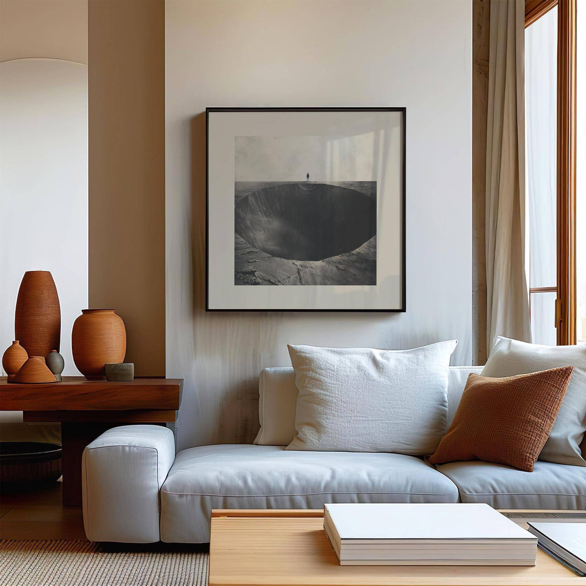 Surrealist wall art of a large abyss hole above a white sofa with cushions in a living room