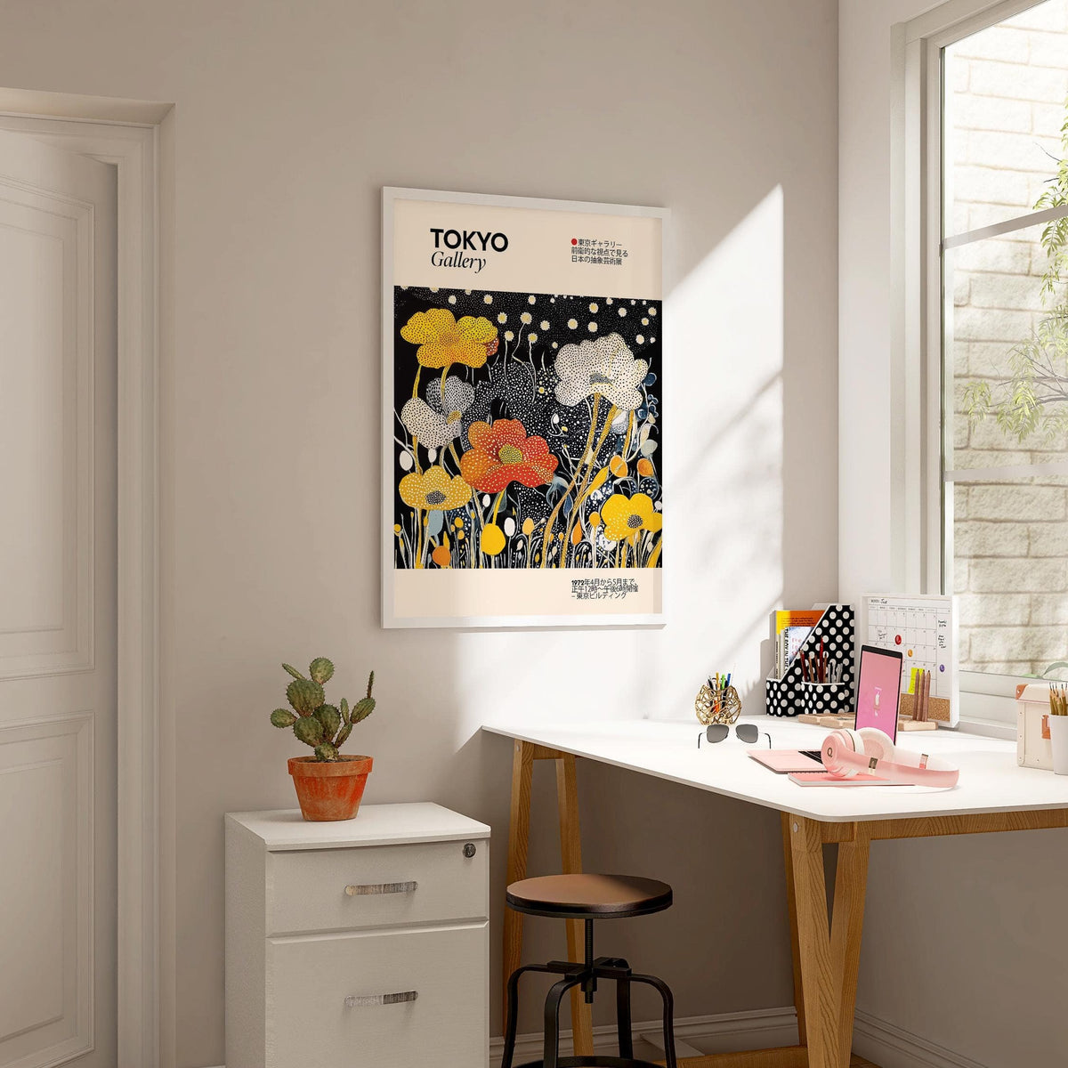 Japanese Decor wall art of stylized flower bouquet in yellow white and orange above a plant on a cabinet