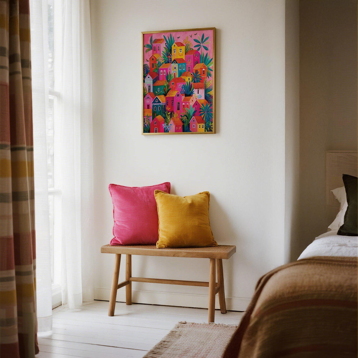 Eclectic wall art with Mexican Village Painting of rooftops and foliage.