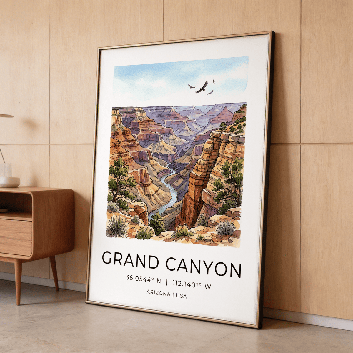 Framed Grand Canyon art print with blue sky and rocky canyon colours leaning on a wooden wall