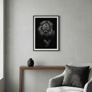 Black Lion Art Print framed on a grey wall above a wooden console with a black vase in a minimalist room